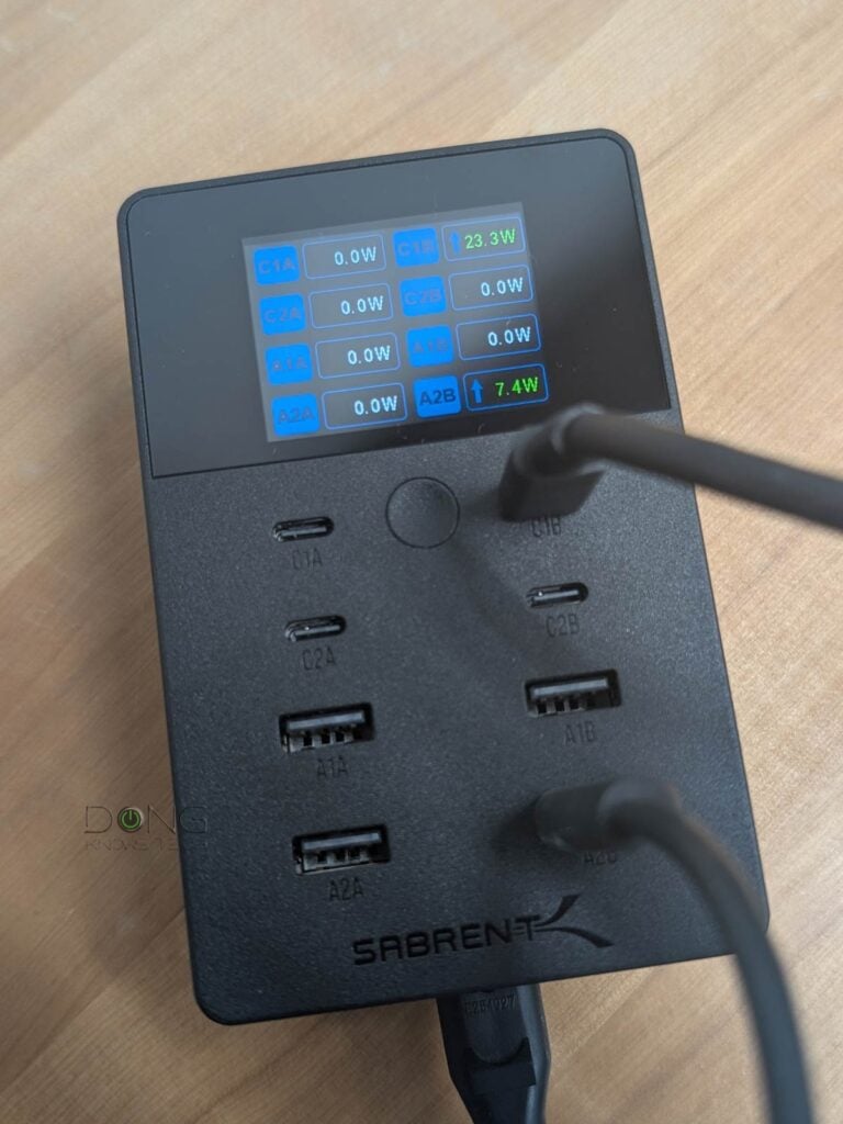 A USB charger in action, note its status screen