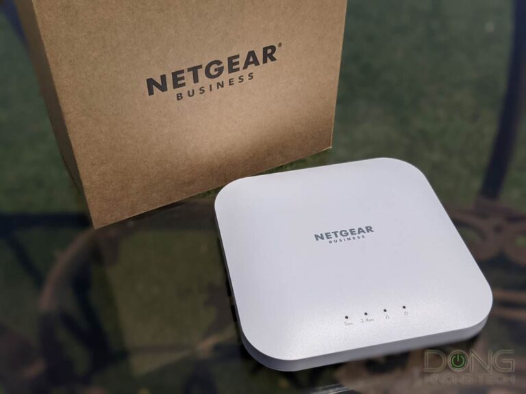 NETGEAR WAX214 Business Wi-Fi 6 Access Point Next to Retial Box