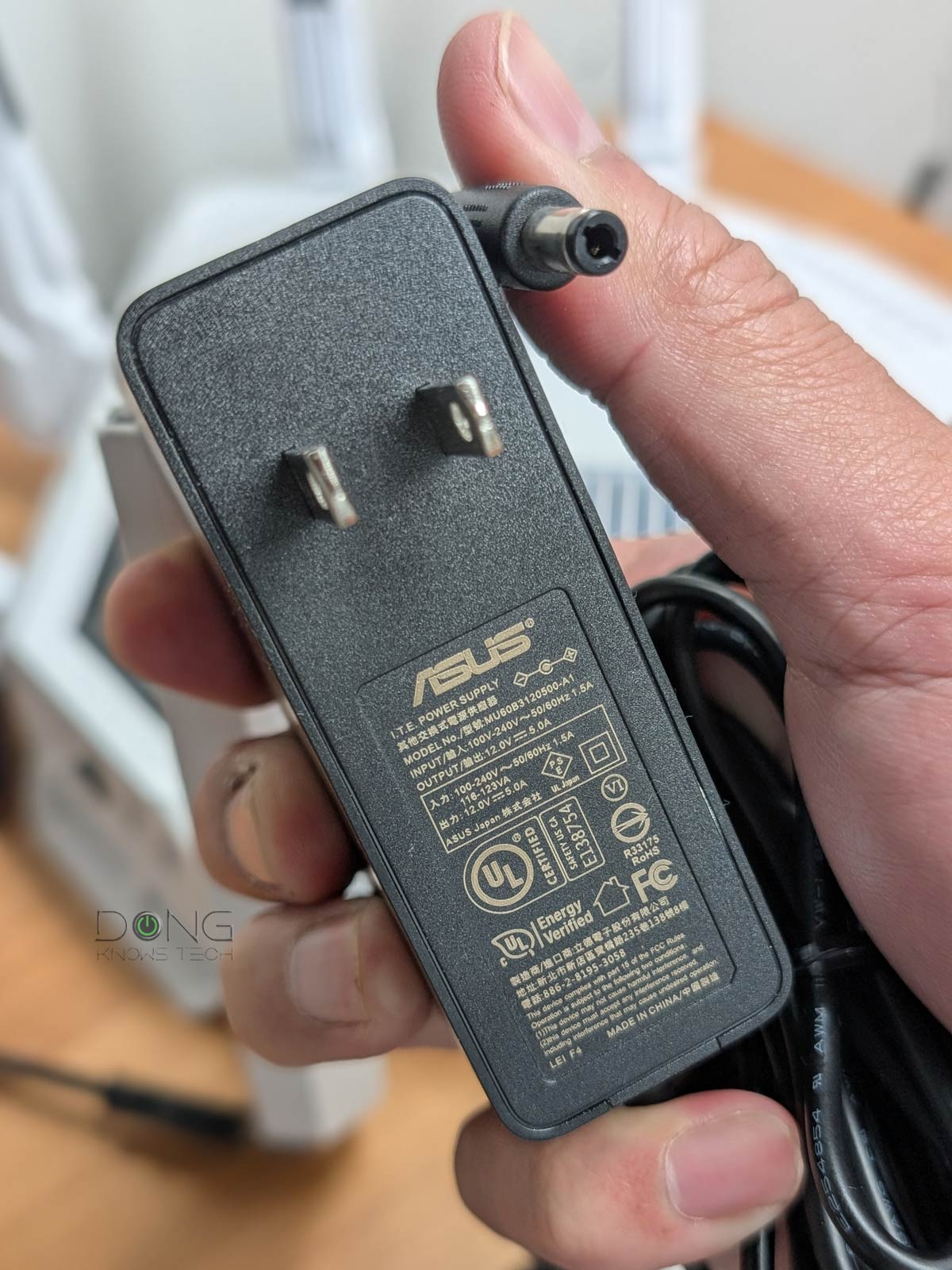 ROG Rapture GT-BE19000AI Review (vs. GT-BE98 Pro): ASUS's Best, Yet Imperfect, Wi-Fi 7 Router 12 The ASUS GT BE19000AI power adapter