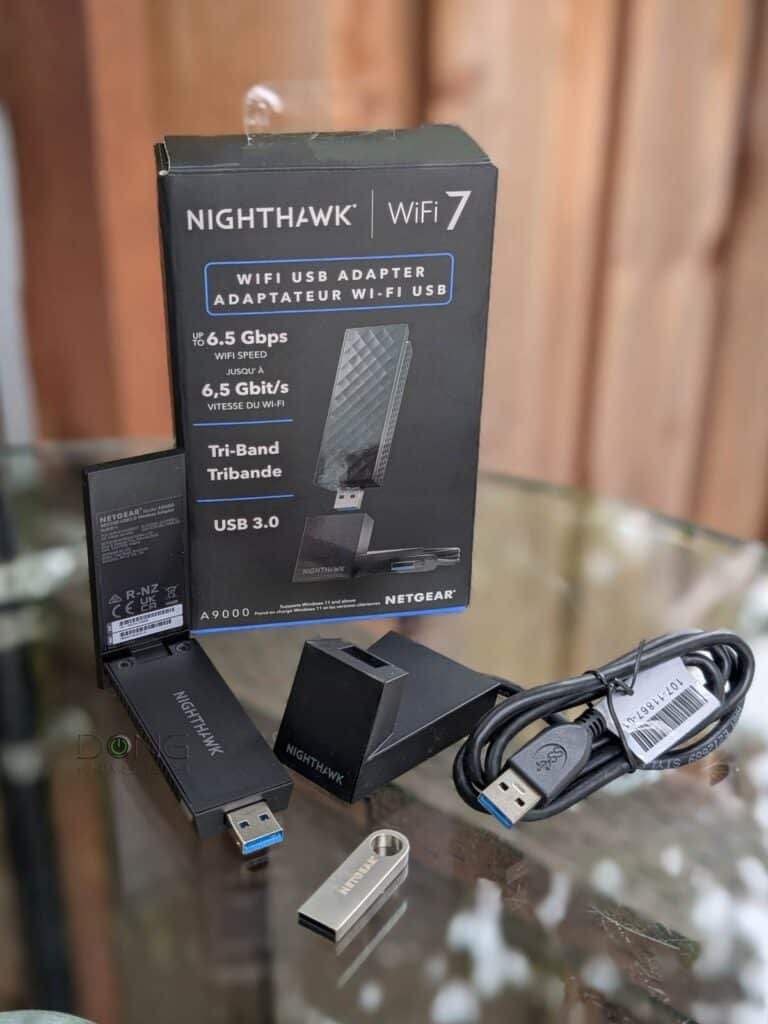 NETGEAR Nighthawk A9000 Review (vs. Nighthawk A8000): A Fast Wi-Fi 7 Upgrade 1 The NETGEAR Nighthawk A9000 Wi Fi 7 Adapter comes with a base and a little USB thumb drive that contains the software driver