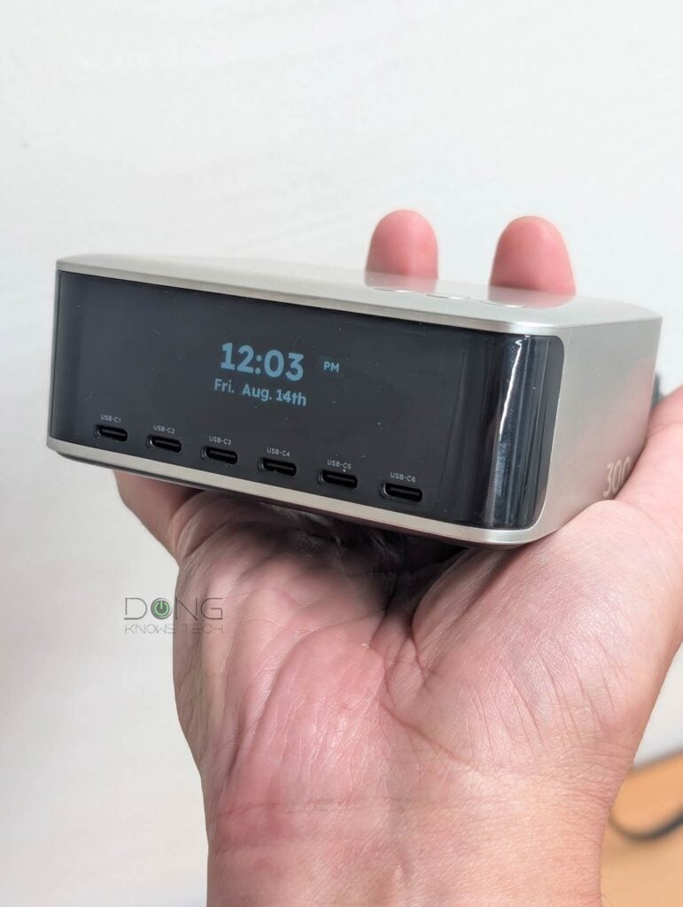 The UGREEN Nexode Pro 300W Desktop Charger (X873) is relatively compact and quite heavy. Note its screen which is current set to show a lock as a screensaver